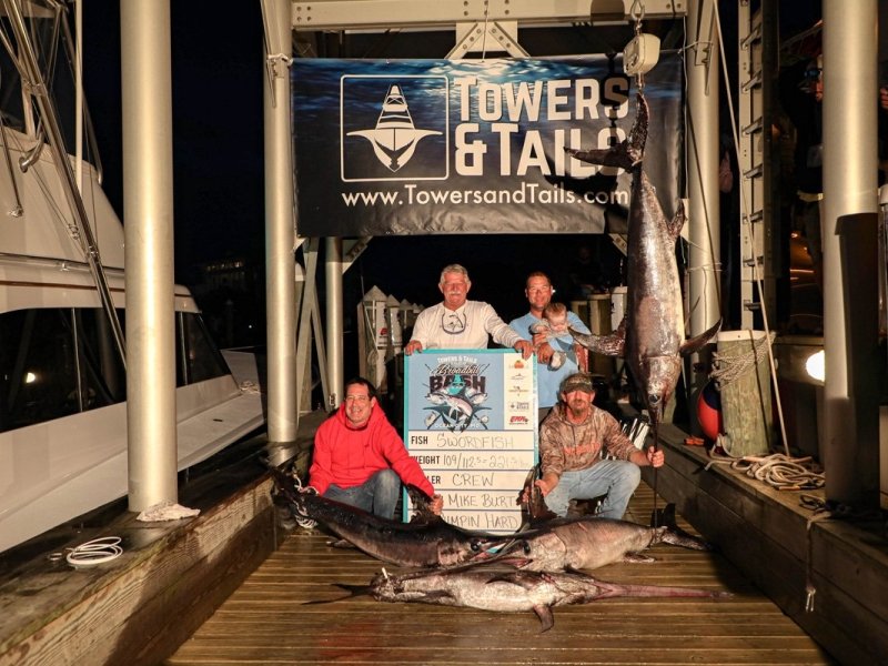 group-of-men-with-swordfish-on-dock.jpg